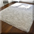 DR03. White rug. Measures approx. 8' x 10' 